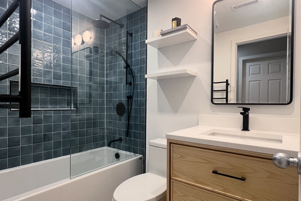 updated bathroom with toilet, sink, and bathtub in Des Plaines, IL
