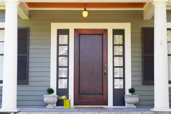entryway with blue door leading into a renovated home in Western Springs