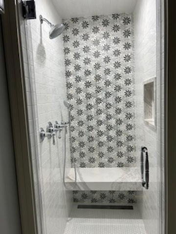 a remodeled bathroom with a shower curtain and window in Glenview