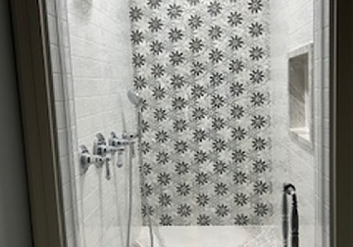 a remodeled bathroom with a shower curtain and window in Glenview