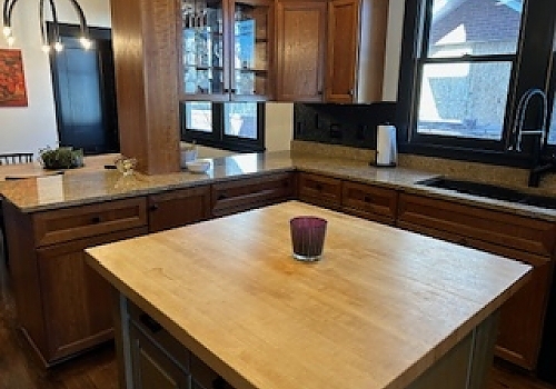 kitchen cabinetry upgrade with a wooden table by Park Ridge remodelers