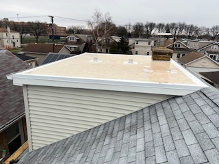 white and black roofed building renovation in Des Plaines, IL