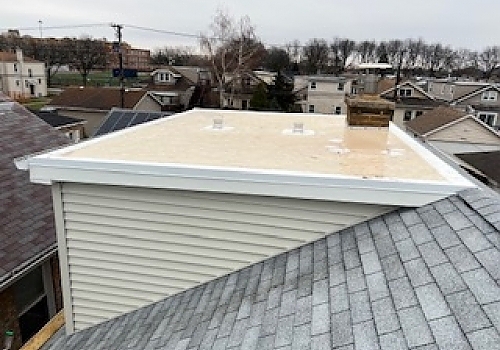 white and black roofed building renovation in Des Plaines, IL