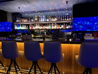 bar area with custom-built counter by Plumb Tree Builders in Park Ridge