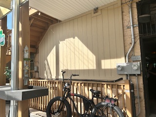 bike parked by a wooden fence in a Park Ridge home improvement site