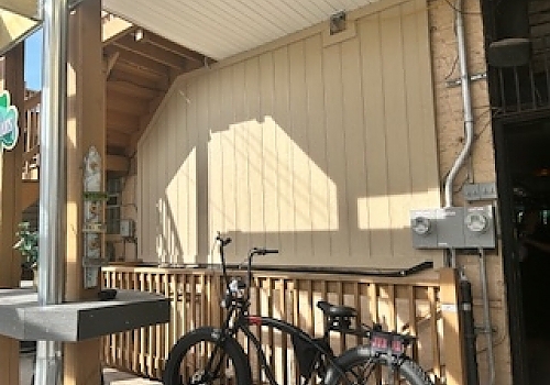 bike parked by a wooden fence in a Park Ridge home improvement site