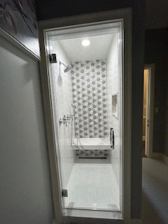 white bathtub installed next to white toilet in a Glenview bathroom