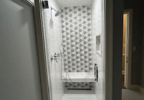 white bathtub installed next to white toilet in a Glenview bathroom