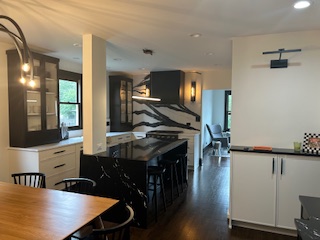 kitchen in Des Plaines, IL, featuring a stove, fridge, sink, and table