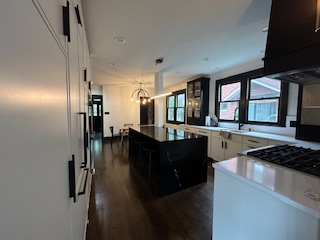 kitchen remodel with stove, sink, refrigerator, and microwave in Hinsdale