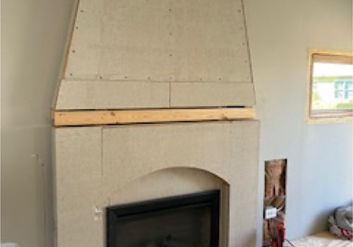 fireplace remodel with brick wall and fireplace unit in Park Ridge