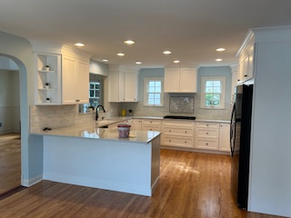kitchen area with new stove, fridge, sink, and cabinetry in Park Ridge