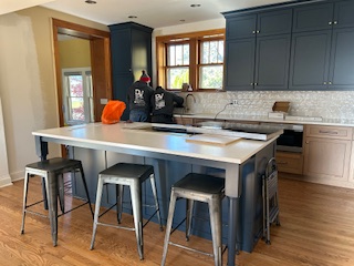 kitchen with television and updated fridge in Hinsdale
