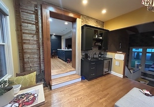 kitchen area with TV and fridge in Des Plaines, IL